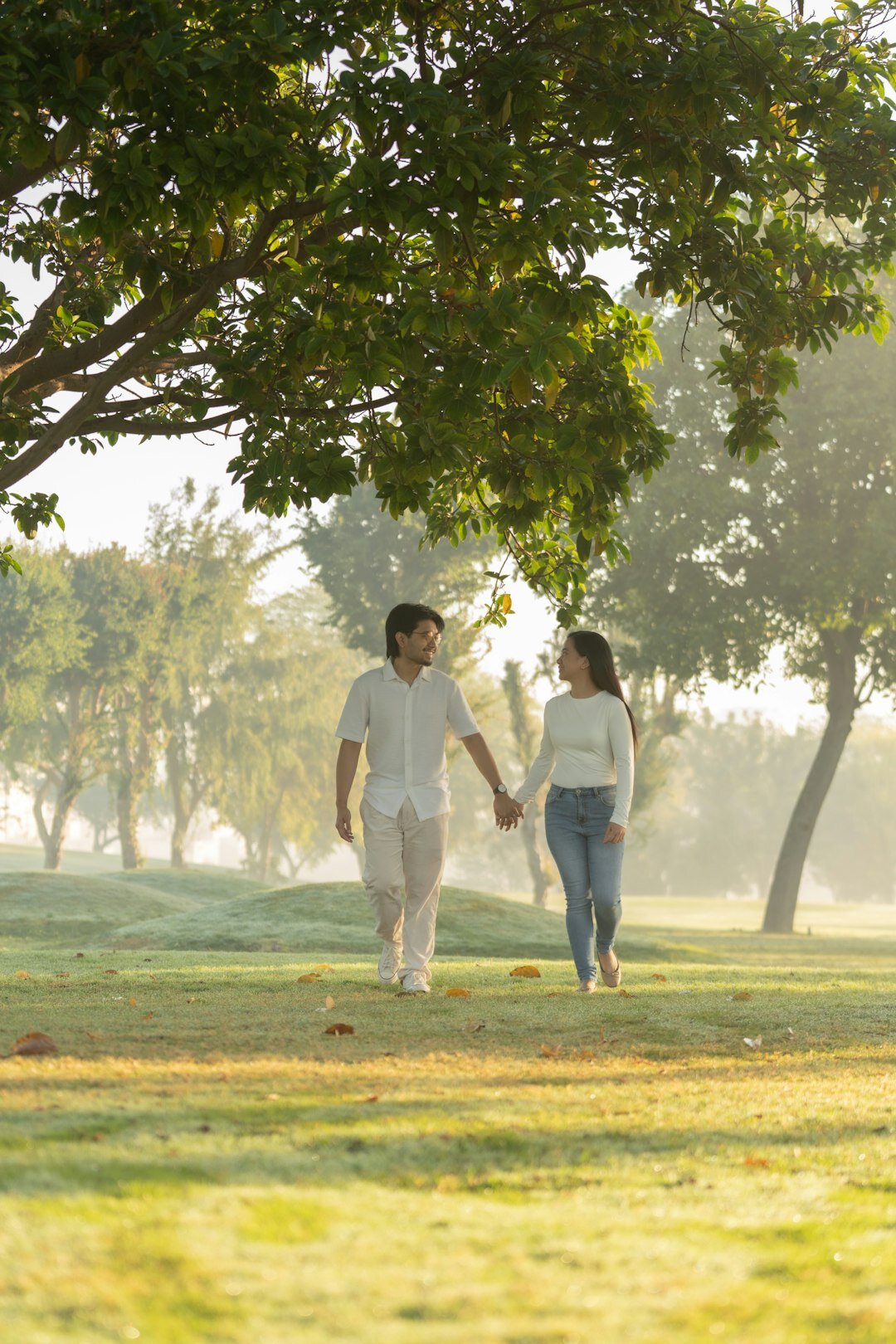 celebrity couple walking in park