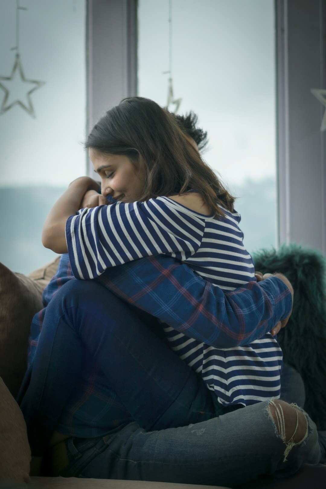 celebrity couple embracing after argument